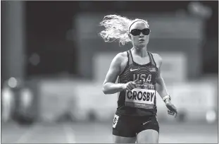  ?? Team USA ?? Legally blind Paralympic sprinter Kym Crosby was born with albinism, which can affect developmen­t of the optic nerve.