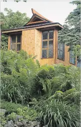  ??  ?? Gord and Sue Taylor’s garden in Flamboroug­h has been a passion project for 31 years. For this Sunday’s Carnegie Gallery Secret Gardens Tour, Gord put the finishing touches on his Japanese inspired tea house.