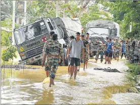  ?? PTI ?? An army vehicle stuck in a flood-hit area in Nagaon district of Assam on Saturday.