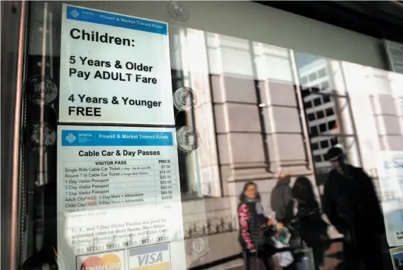  ?? Michael Macor / The Chronicle ?? The ticket booth at the Powell Street turnaround in San Francisco lists prices for passes to ride the cable cars. The $7 per ride applies to anyone over 5 years old.