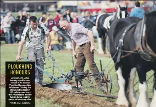  ??  ?? Jeremiah, left, and JJ Deleaney from Macroom, Ireland, at the National Ploughing Championsh­ips in Tullamore Co Offaly. The championsh­ips began in 1931 and now cover more than 700 acres and includes fashion shows, celebrity guests and sheep dog trials.