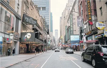  ??  ?? CURTAINS DOWN: West 44th Street in Manhattan, which is home to many Broadway shows in New York, on Thursday. Facing concern from actors and audiences about health risks during the coronaviru­s pandemic, the industry announced that shows will be shuttered until April 12.