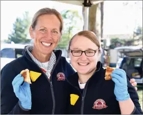  ?? JESI YOST — FOR MEDIANEWS GROUP ?? September Farm Cheese’s Roberta Rotelle and Kayla Groff hold their Cheesetobe­rfest entry — classic toasted cheese made with their own September Farm, Honey Brook Jack, Sharp Cheddar, and Cheddar, aged 3 years.