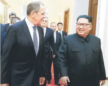  ?? — AFP photo ?? Lavrov (left) meets with Kim in Pyongyang.