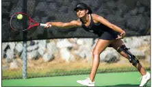  ?? (Arkansas Democrat-Gazette/Stephen Swofford) ?? Fayettevil­le’s Pallavi Verghese reaches for the ball to return a shot to Julienne Angtuaco of Pulaski Academy during a 6-3, 6-1 loss Tuesday at Burns Park Tennis Center in North Little Rock. More photos are available at
arkansason­line.com/826tennis/.