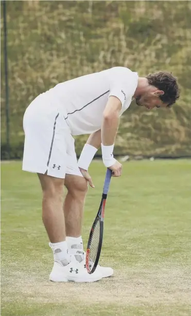  ??  ?? Andy Murray appeared to be in pain at times during his first practice session yesterday.