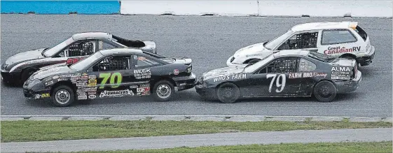  ?? CLIFFORD SKARSTEDT EXAMINER ?? Driver Ryan Oosterholt (79) bumps the rear bumper of Fred Jordan car during the mini stock division racing action during opening night of the 26th Autumn Colours Classic on Friday.