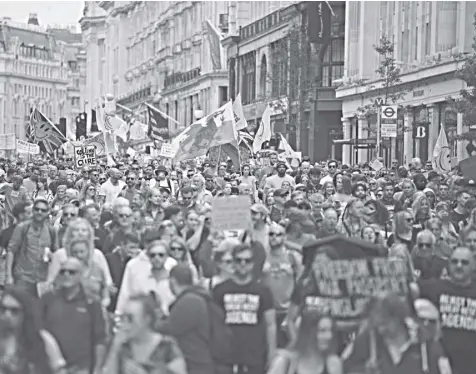  ?? Aaron Chown/pa via AP ?? Protesters match during an anti-lockdown protest, in central London, saturday, June 26, 2021.