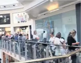  ?? IMAGE: NIALL CARSON/ PA WIRE ?? Families queue at Intu Uxbridge, hoping to make the most of the ‘pay your age’ deal at the Build-A-Bear Workshop