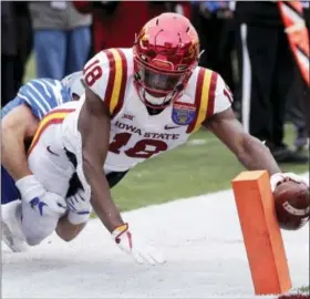  ?? MARK HUMPHREY — THE ASSOCIATED PRESS ?? Iowa State wide receiver Hakeem Butler (18) reaches for the goal line but is knocked out of bounds at the 3-yard line by Memphis defensive back Austin Hall in the second half of the Liberty Bowl NCAA college football game Saturday in Memphis, Tenn.