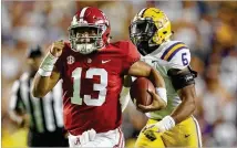  ?? GREGORY SHAMUS / GETTY IMAGES ?? Alabama quarterbac­k Tua Tagovailoa runs for a third-quarter touchdown during Saturday night’s SEC West-clinching 29-0 victory over LSU in Baton Rouge.