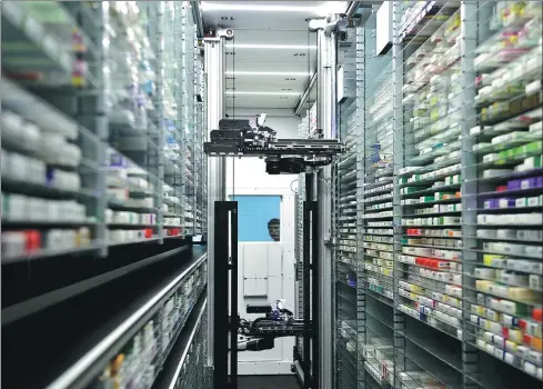  ?? LIU JUNXI / XINHUA ?? An automated system dispenses medicine for patients at Affiliated Fuyang Hospital of Anhui Medical University, in Fuyang, Anhui province.