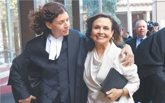  ?? ?? Sue Chrysantho­u SC hugs Lisa Wilkinson as they emerge from court on Monday after Wilkinson’s and Network Ten’s win in the Bruce Lehrmann defamation case. Picture: Getty