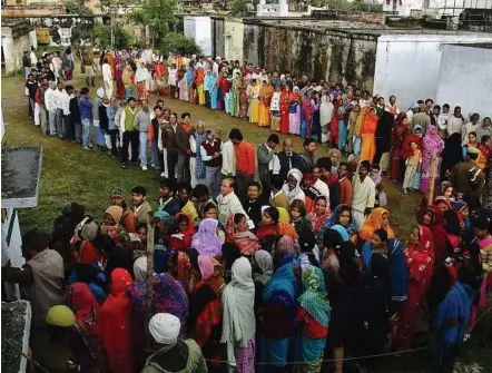  ??  ?? Caste cauldron: Voters queueing up outside a polling centre to cast their vote in Haraiya town during the state assembly election in Uttar Pradesh on Feb 8. Uttar Pradesh is immersed in a bitterly fought electoral battle, with each party relying on...