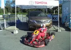  ?? JIM KENZIE FOR THE TORONTO STAR ?? While the kids are off learning on go-karts, the Kartstart program lets their parents test-drive grownup autos from sponsor Toyota.