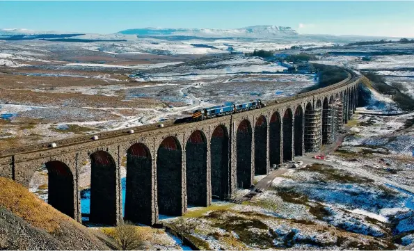  ?? (Network Rail/Tom Beresford) ?? Ribblehead Viaduct, with a Network Rail route-proving train and two independen­t snowplough­s crossing on February 11.