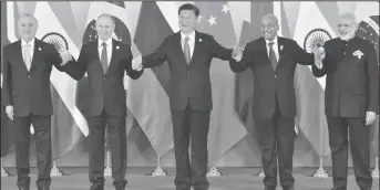  ??  ?? (L-R) Brazil’s President Michel Temer, Russian President Vladimir Putin, Chinese President Xi Jinping, South Africa’s President Jacob Zuma and Indian Prime Minister Narendra Modi pose for a group photo during the BRICS Summit at the Xiamen...