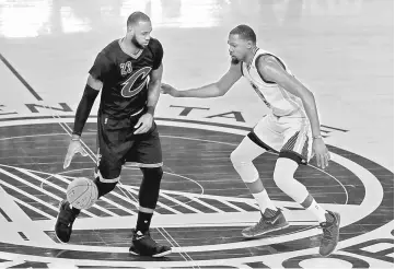  ??  ?? LeBron James (left) of the Cleveland Cavaliers is defended by Kevin Durant of the Golden State Warriors during the second half of Game 2 of the 2017 NBA Finals at ORACLE Arena in Oakland, California in this June 4 file photo. — AFP photo