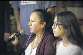  ?? CAITLIN O’HARA / NEW YORK TIMES ?? Guadalupe Garcia de Rayos, with daughter Jacqueline Rayos, 14, speaks to reporters Thursday at a soup kitchen in Nogales, Mexico, a day after Garcia de Rayos was deported from the United States.