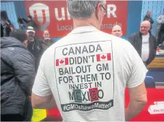  ??  ?? ABOVE GM workers gather for a meeting at Unifor Local 222 near the General Motors Co’s assembly plant in Oshawa, Ontario.