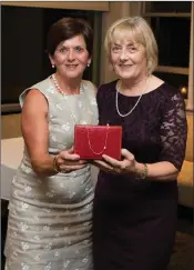  ??  ?? Patricia Slattery collects her prize from BLainroe Golf Club Lady President Bernie Nelson.