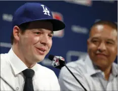  ?? AP PHOTO ?? LEFT: Los Angeles Dodgers pitcher Rich Hill (left) speaks as manager Dave Roberts looks on during a media availabili­ty at Major League Baseball's winter meetings Monday in Oxon Hill, Md. RIGHT: In a Oct. 13 file photo, Washington Nationals relief...