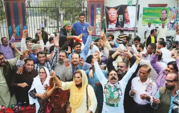  ?? AP ?? Supporters of former prime minister Nawaz Sharif celebrate a court decision in favour of their leader, outside a hospital where he is receiving treatment, in Lahore yesterday.