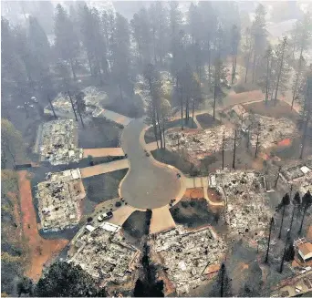  ?? CAROLYN COLE, LOS ANGELES TIMES ?? An aerial view of a burned-out subdivisio­n in Paradise, California, last week.