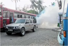  ??  ?? Operation fumigation at the Kalutara main bus stand. Pic by S. Siriwarden­a