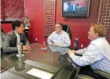  ?? [PHOTO BY CARLA HINTON, THE OKLAHOMAN] ?? Jeff Summerford, John Braaten and Jason McWilliams talk together during their weekly meeting at Impression­s Printing, 2241 W Interstate 44 Service Road.