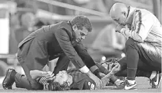  ??  ?? Barcelona’s Argentinia­n forward Lionel Messi receives medical assistance during the Spanish league football match FC Barcelona against Sevilla FC at the Camp Nou stadium in Barcelona on October 20, 2018. — AFP