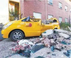  ??  ?? A damaged vehicle in the quake-hit South Korean city of Pohang on Wednesday.