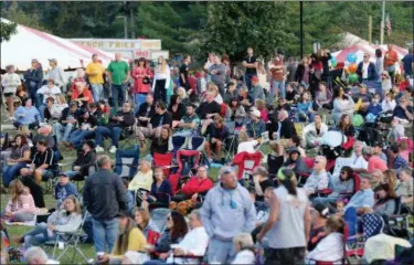  ?? JONATHAN TRESSLER — THE NEWS-HERALD FILE ?? The crowd at Mentor CityFest was thousands deep in front of the city’s new amphitheat­er as Pink Floyd cover band Dark Side of the Moon prepared to play.