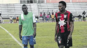  ?? (Photo: Paul Reid) ?? Dwayne Ambusley (left), who came out of retirement to shore up his team’s midfield, keeps an eye on Arnett Gardens forward Renaldo Cephas during the Jamaica Premier League game at the Montego Bay Sports Complex on Sunday, May 8, 2022.