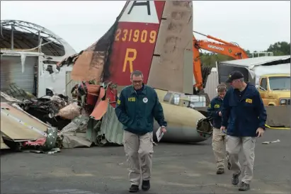  ?? NTSB photo ?? NTSB investigat­or-in-charge Bob Gretz near the site of the Oct. 2, 2019 crash of a B-17 at Bradley Internatio­nal Airport.