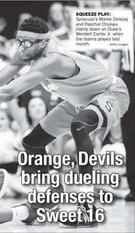  ??  ?? Syracuse’s Marek Dolezaj and Paschal Chukwu clamp down on Duke’s Wendell Carter Jr. when the teams played last