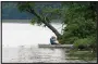  ?? MEDIANEWS GROUP ?? A bird-watcher in a boat on Hopewell Lake in French Creek State Park, Union Township.