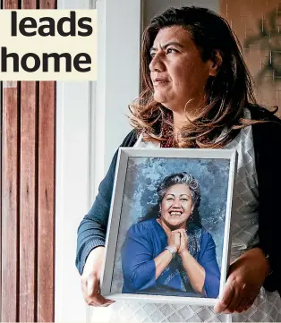  ?? ABIGAIL DOUGHERTY/STUFF ?? Josephine Bartley with a picture of her mother Ruth, who she says had a chronic gambling problem that led to her losing the family home.