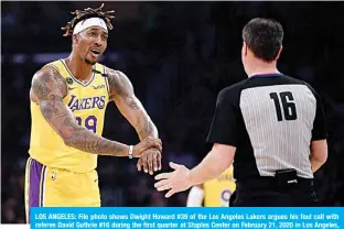  ??  ?? LOS ANGELES: File photo shows Dwight Howard #39 of the Los Angeles Lakers argues his foul call with referee David Guthrie #16 during the first quarter at Staples Center on February 21, 2020 in Los Angeles, California. —AFP