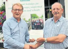  ?? PHOTOS SUPPLIED ?? LNBP co-vice-chairman Alan Cobbold, right, receives a cheque from Geoff Walker, charity steward of the Warwickshi­re Freemasons.