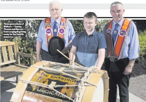  ?? NEWRAYPICS ?? Three generation­s of Walkers — Tommy, Thomas and Mervyn — from Loughgall getting ready for the Twelfth