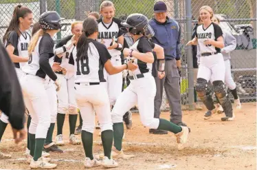  ?? KEVIN R. WEXLER/NORTHJERSE­Y.COM ?? LeeAnn Downey is surrounded by her Ramapo teammates after hitting a home run on April 25, 2023. The homer put Ramapo ahead and ended up beating Ridgefield Park, 12-2.