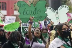  ?? Marco Ugarte/Associated Press ?? A woman holds up a sign with a message that reads in Spanish, “I will decide” as she joins a march demanding legal, free and safe abortions for all women, marking Internatio­nal Safe Abortion Day, in Mexico City, on Sept. 28, 2022.