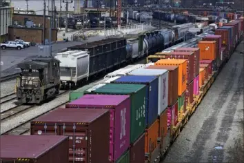  ?? Associated Press ?? This April 2021 photo shows freight train cars and containers at Norfolk Southern Railroad's Conway Yard in Conway, Beaver County. Railroad engineers accepted their deal with the railroads that will deliver 24% raises, but conductors rejected the contract, casting more doubt on whether the industry will be able to resolve the labor dispute before next month’s deadline without Congress’ help. The votes by the two biggest railroad unions on Monday follows the decision by three other unions to reject their deals with the railroads that the Biden administra­tion helped broker before the original strike deadline in September.