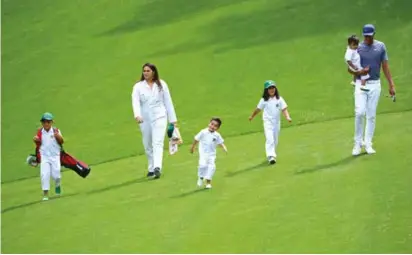  ??  ?? Tony Finau and family [left] get into their stride at Augusta National’s Par 3 Contest last year; Finau celebrates his ace [right] just before misfortune strikes