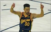  ?? RICK BOWMER — THE ASSOCIATED PRESS ?? Steph Curry throws up fingers on both hands as a tribute to No. 31, Reggie Miller, whom Curry passed on the alltime list for 3-point baskets Saturday night.
