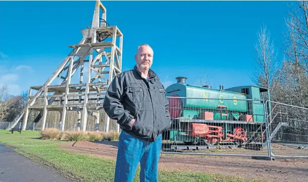  ??  ?? MINING HERITAGE: Tom Kinnaird, chairman of Benarty Community Council, at Mary Pit Head winding tower in Lochore Meadows Country Park.