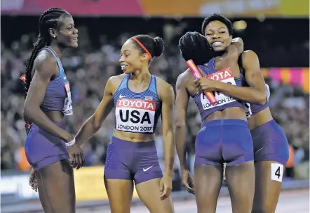  ?? DAVID J. PHILLIP/THE ASSOCIATED PRESS ?? The gold medal-winning U.S. relay team, from left, Shakima Wimbley, Allyson Felix, Quanera Hayes and Phyllis Francis celebrate Sunday after the women’s 4x400-meter relay final during the World Athletics Championsh­ips in London.