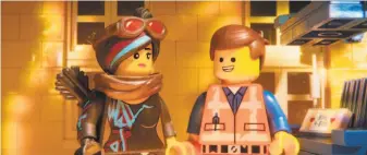  ?? Warner Bros. Pictures ?? Characters Lucy/Wyldstyle (left), voiced by Elizabeth Banks, and Emmet, voiced by Chris Pratt, in a scene from the enjoyable “Lego” sequel, which builds on what made the first movie work.