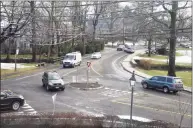  ?? File / Tyler Sizemore / Hearst Connecticu­t Media fiel photo ?? Traffic passes through the roundabout at the intersecti­on of Sound Beach Avenue and Laddins Rock Road bordering Binney Park in Old Greenwich last December.